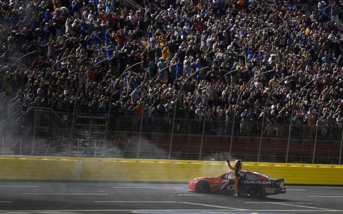 Martin Truex Jr. celebrates after winning the 2016 Coca-Cola 600 at Charlotte Motor Speedway.