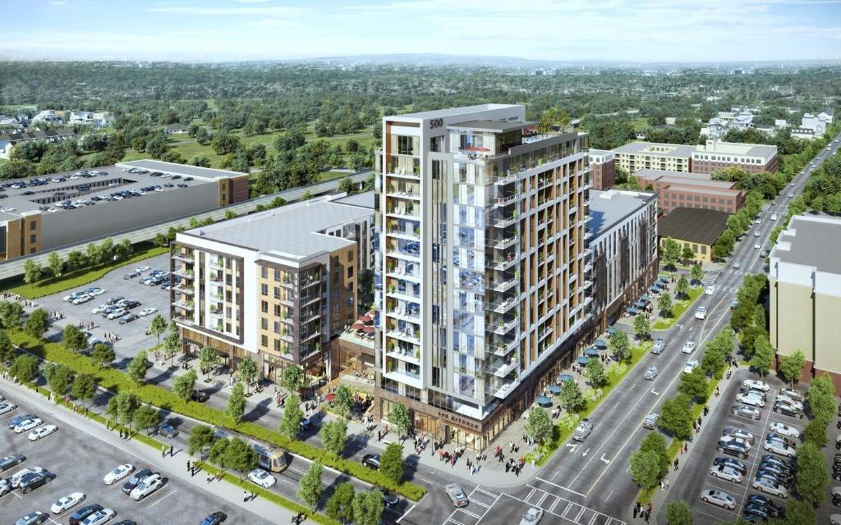 A rendering of the planned apartment building, with a 14-story tower and mid-rise portion, at 500 West Trade Street.