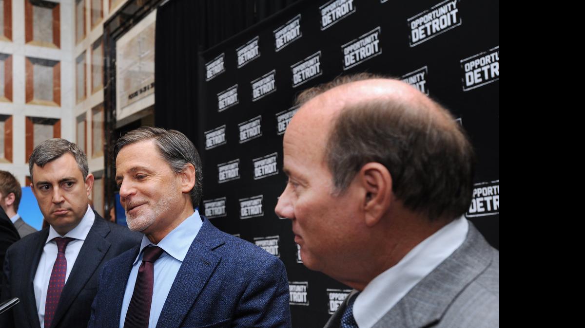 
Ally CEO Jeff Brown, left, Quicken Loans/ Rock Ventures Chairman Dan Gilbert, right and Detroit Mayor Mike Duggan announce the move of 1,500 Ally employees into new headquarters in Detroit on March 31. Ally, which employs about 800 people in Charlotte, said the move will have no impact on its local employment footprint. The company announced first quarter earnings Tuesday that topped Wall Street estimates thanks to a one-time gain related to the sale of a Chinese company earlier this year.
