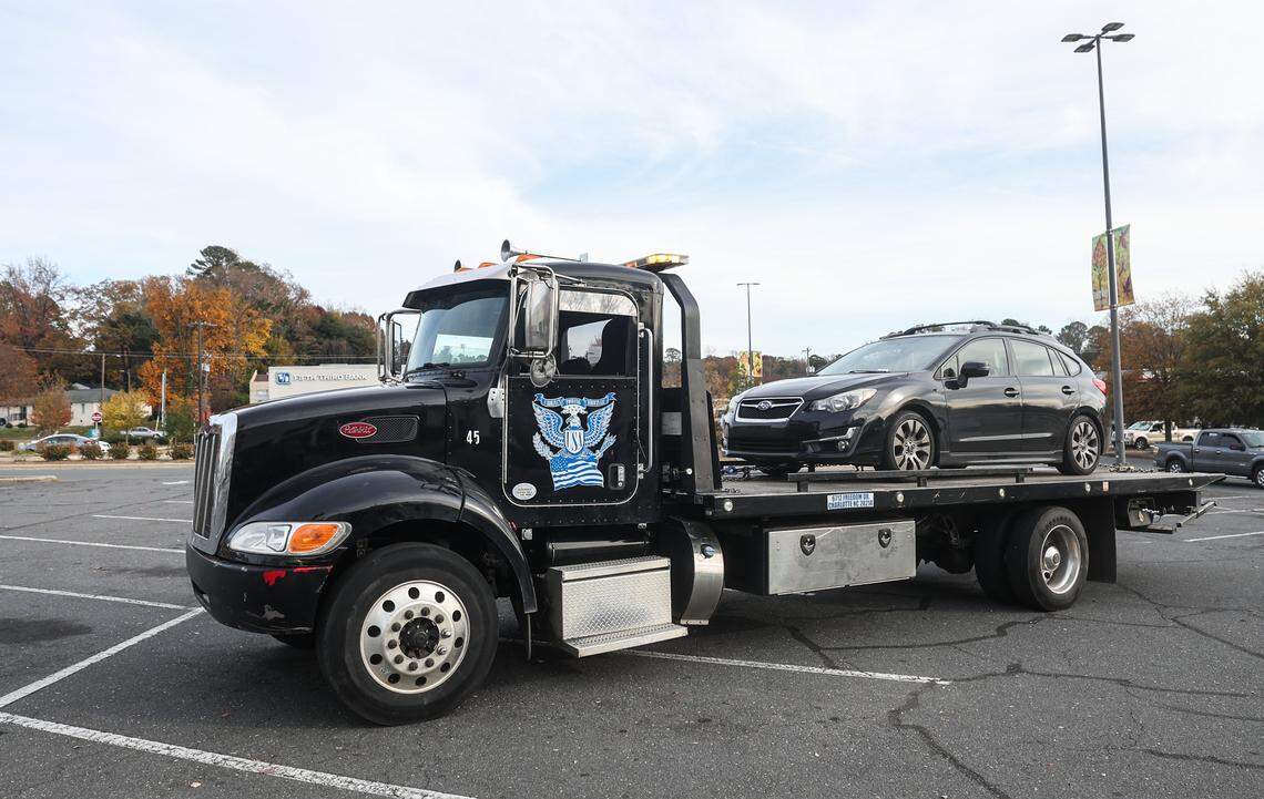 A vehicle sits atop the bed of a Carolina’s Towing truck after it was left behind when the owner was arrested by Border Patrol at Eastway Crossing in Charlotte. Carolina’s Towing is a Hispanic-owned business on Freedom Drive that is offering free towing service  to help families recover vehicles after a loved ones has been detained.
