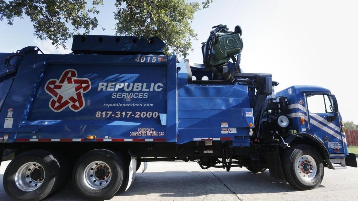 A Republic Services truck makes the rounds of a south Arlington, Texas, neighborhood to empty the recycling containers, on Aug. 28, 2014. Republic Services said Thursday it will open a customer service center in Charlotte.