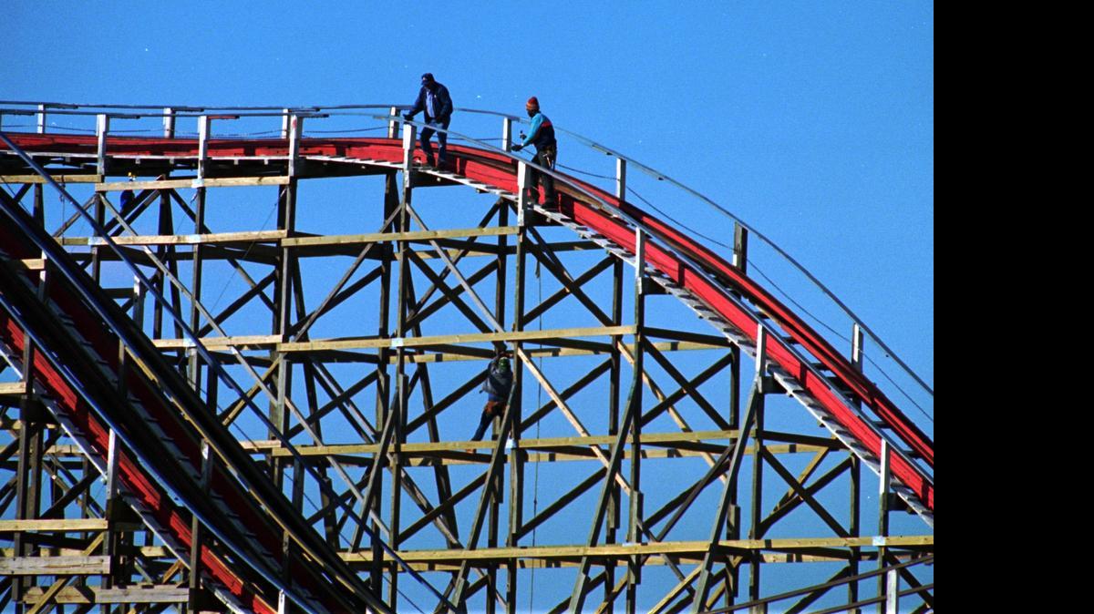 
Workers perform  maintenance on the Thunder Road roller coaster in 1994.
