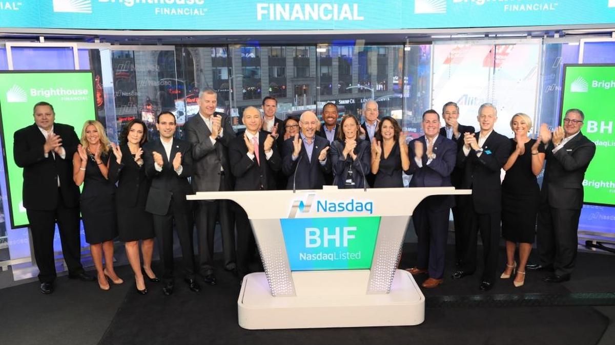 Brighthouse Financial employees ring the Nasdaq opening bell August 7, 2017, in New York’s Times Square, on the Charlotte-based company’s first day of trading.