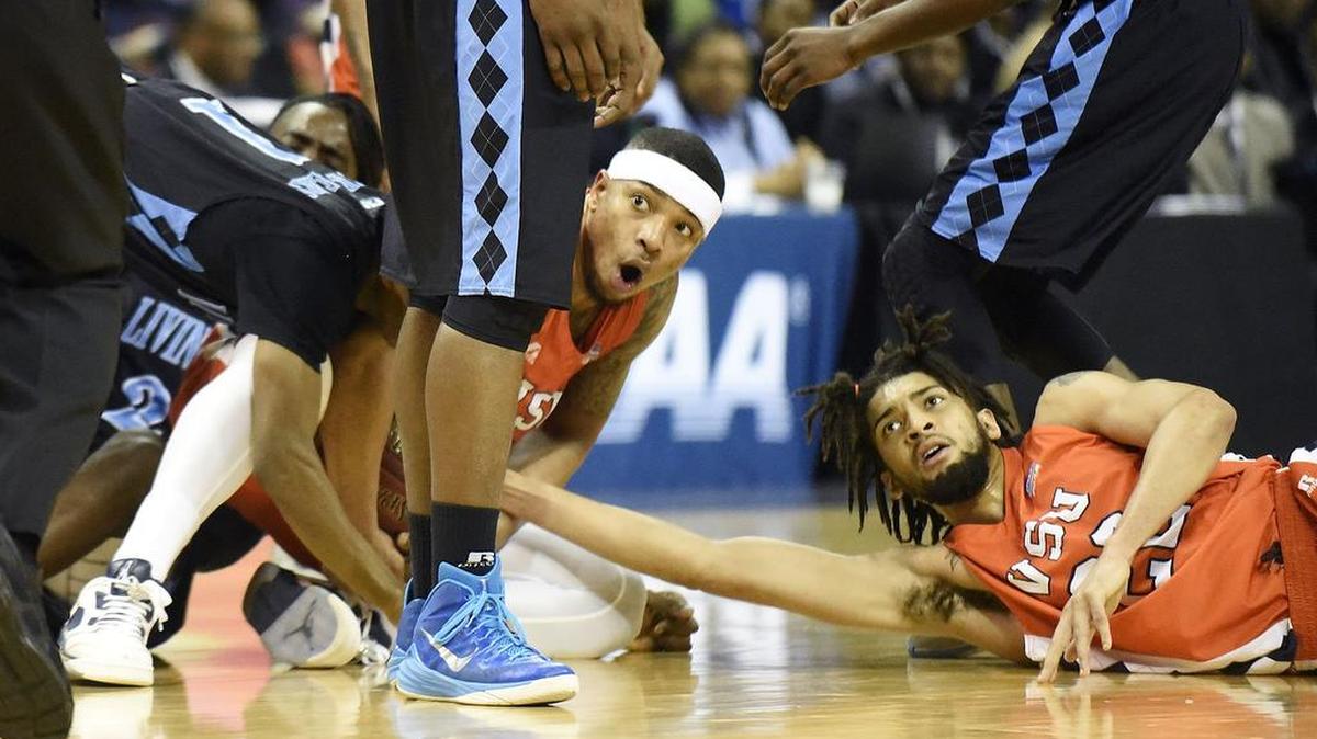 Virginia State's Javon Moore (left), #5 and Melvin Gregory, #22, doubt the referee's call after a second half scramble in the second half of the CIAA men's championship game on Saturday, Feb. 27, 2016.