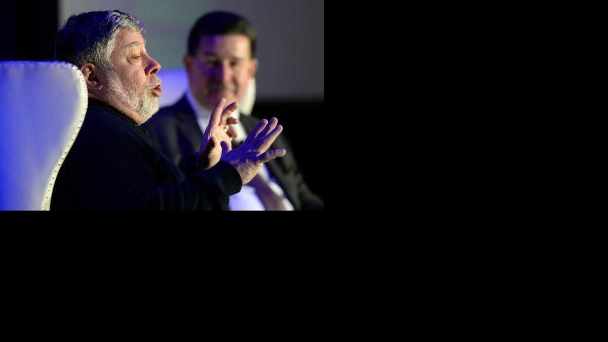 
Apple co-founder Steve Wozniak, left, addresses an audience Wednesday as moderator Mike McGuire looks on during the keynote luncheon of the 9th annual Southeast Venture Conference and Digital Summit Charlotte at the Le Meridien Charlotte. 
