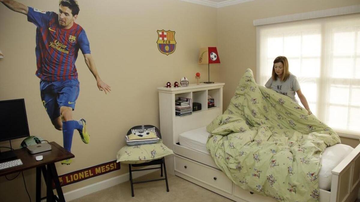 Therese Lehane fixes one of the rooms she is renting out for the Super Bowl at her home in San Jose, Calif. Residents looking to make a quick buck are offering their homes at super-sized prices to the 1 million visitors expected in the area as the Carolina Panthers and Denver Broncos meet in Super Bowl 50.