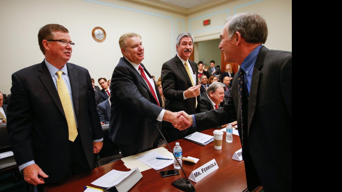 
Congressional Steel Caucus Vice Chair Rep. Pete Visclosky, D-Ind., right, greets, from left, ArcelorMittal USA President and CEO Michael Rippey, Nucor Corporation Chairman, President, and CEO John Ferriola, and US Steel Corporation President and CEO Mario Longhi, on Capitol Hill in Washington, Thursday, March 26, 2015, before a Congressional Steel Caucus hearing to discuss the state of the U.S. steel industry. 
