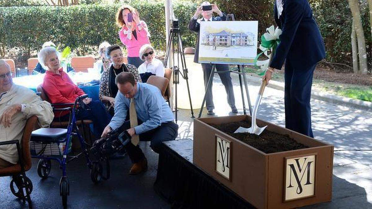 
 Anne Moffat, right, president and CEO of Sharon Towers, turned a spade of dirt during a symbolic ground breaking ceremony for Magnolia Villas on Wednesday April 1, 2015. A ground breaking ceremony happened later at the actual site of the new structure. Sharon Towers residents and officials were in attendance for a ground breaking ceremony for a new structure, Magnolia Villas, that will begin construction soon. 
