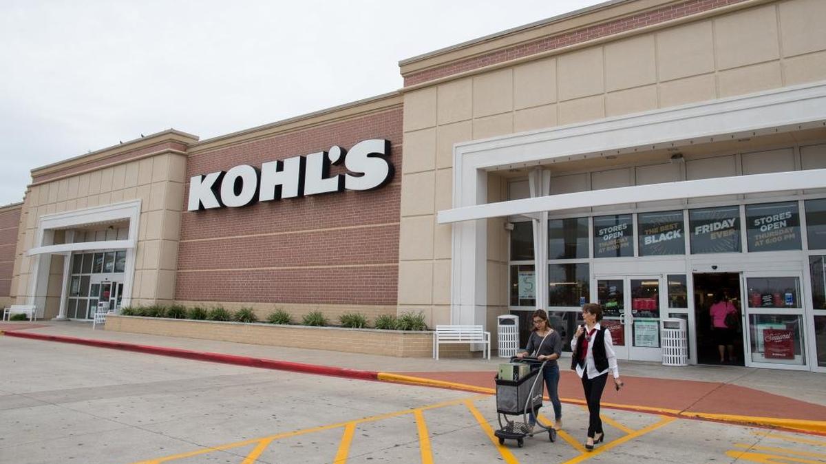 In this Nov. 27, 2015, file photo, shoppers push a cart of items as they leave Kohl’s in Corpus Christi, Texas. Kohl’s plans to hire more than 69,000 additional workers for the 2016 holiday season to meet demand at more than 1,100 stores nationwide.