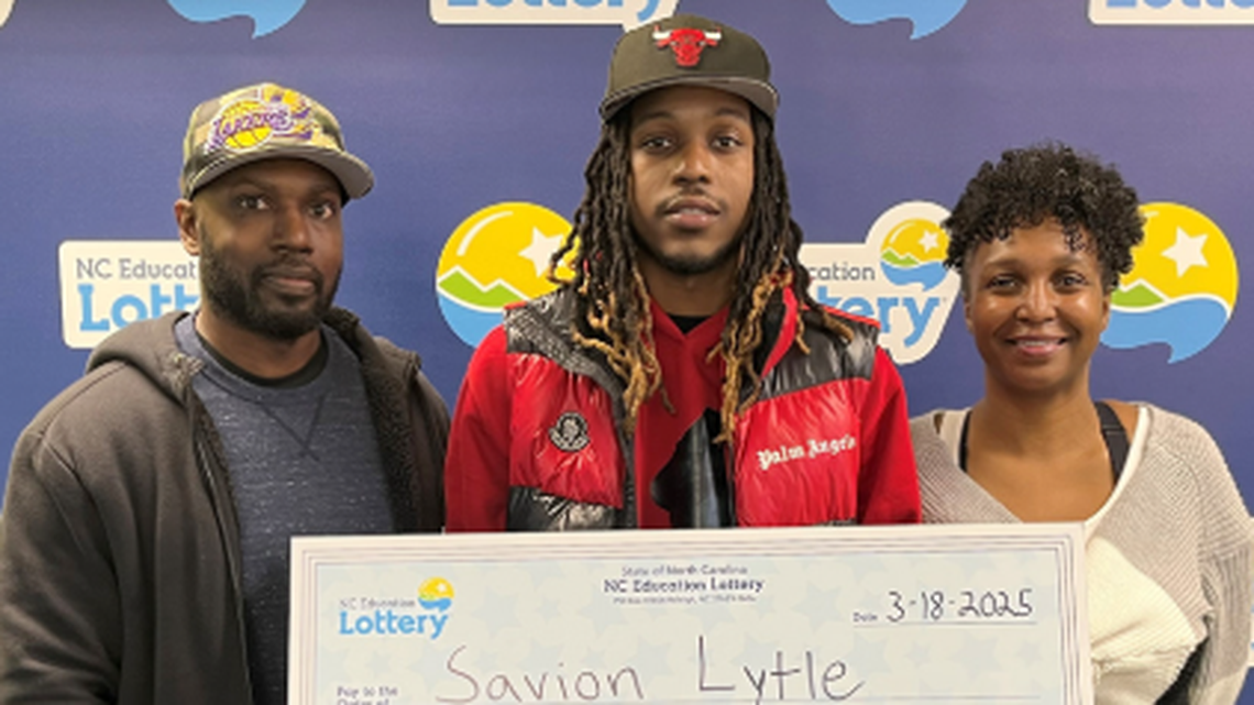 Savion Lytle, pictured with his mom Denise Lytle and her fiance Larry McConnell, got much richer on a visit to North Carolina.