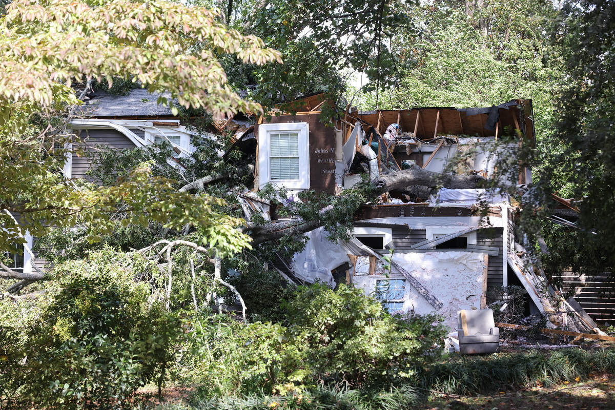 Rock Hill and Charlotte firefighters worked early Friday morning to pull a couple from a home on Poinsett Drive in Rock Hill that was crushed by a large tree.