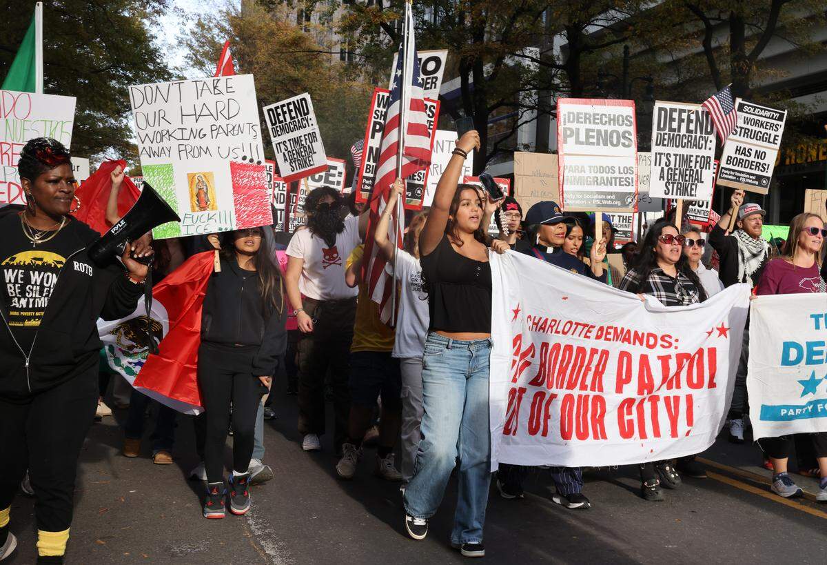 Protesters in uptown Charlotte march at the No Border Pratrol protest on Saturday, Nov. 15, 22025.