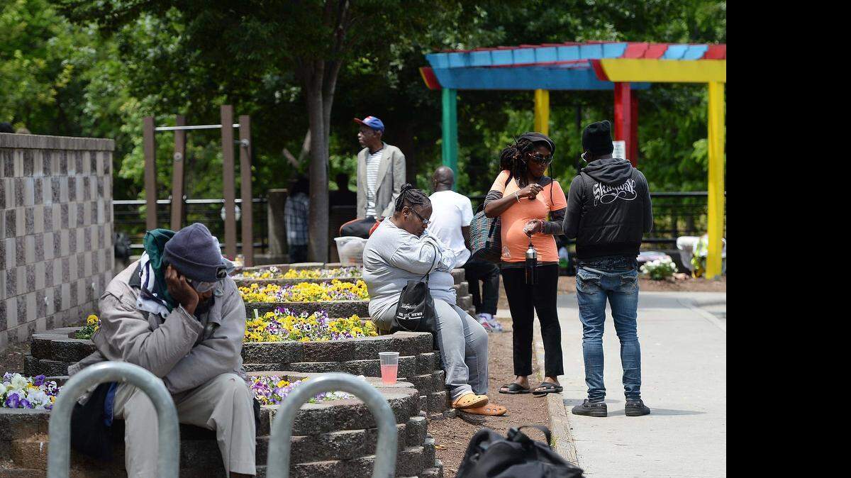 
People gather outside at the Urban Ministry Center in Charlotte on Thursday.

