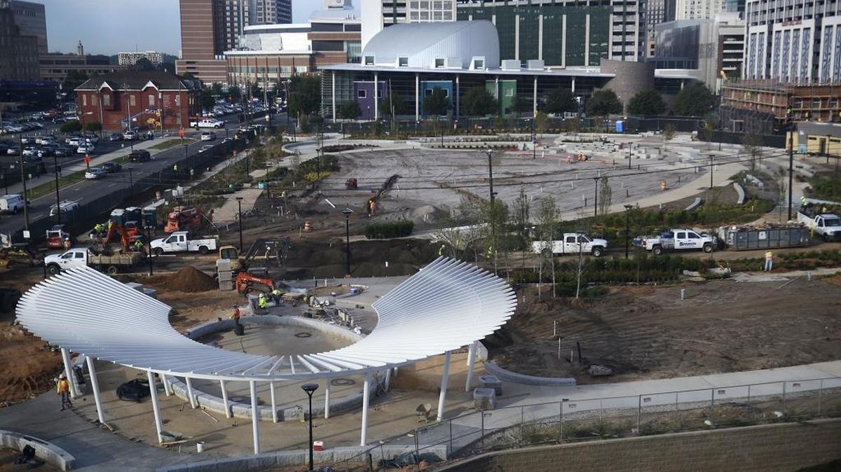 
Construction progressed on Wednesday at First Ward Park between ImaginOn children's library on Seventh Street and UNC Charlotte's Center City campus on Ninth Street. The park is expected to open to the public in November. 

