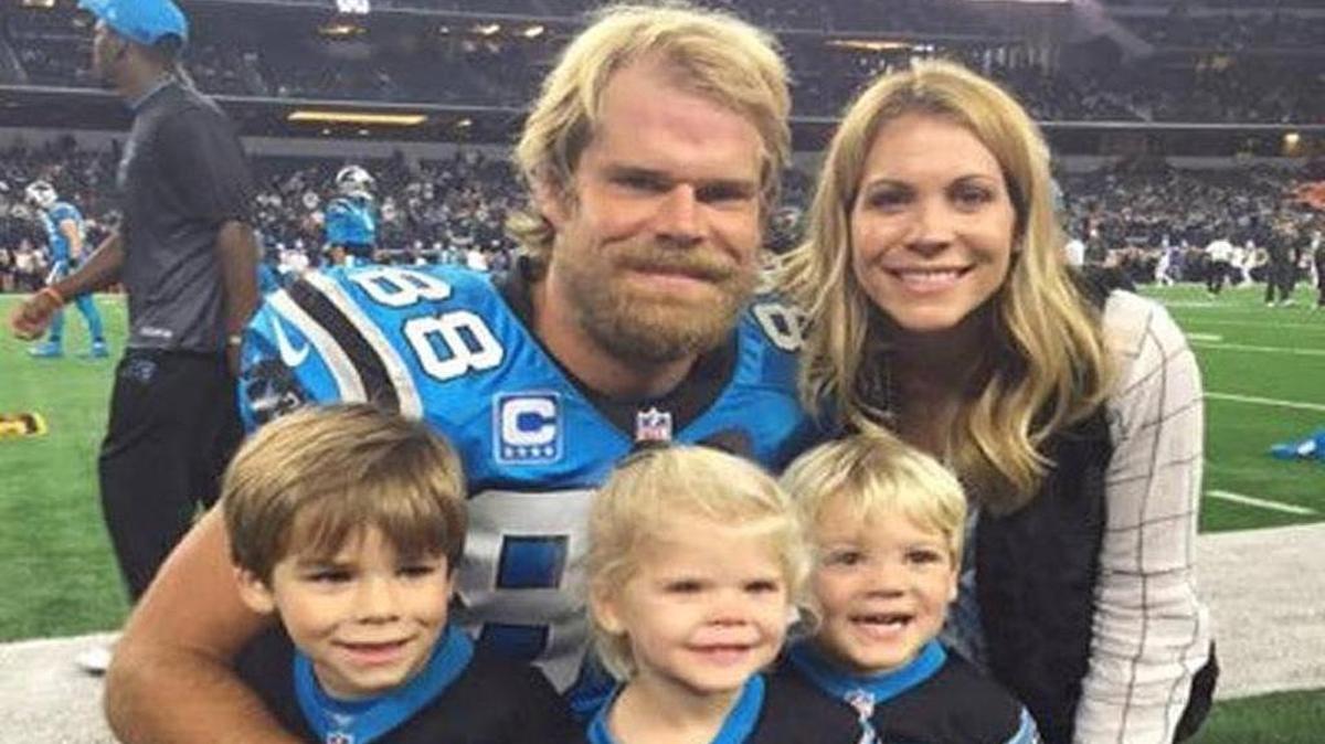 Greg Olsen is surrounded before a Panthers game by his wife, Kara, and, from left, their three children Tate, Talbot and T.J. It was T.J. Olsen’s congenital heart defect that prompted the Olsen family to launch into charity work.