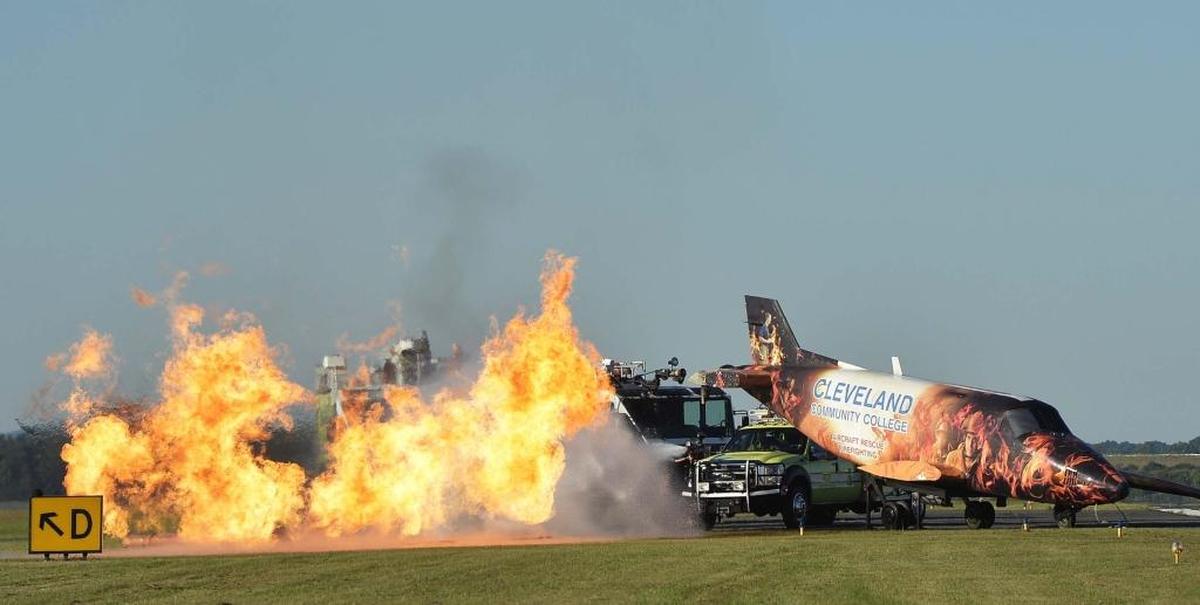 Emergency workers put out a fire at the small plane that crashed into a Airbus A319 during a disaster drill. Charlotte Douglas held a Triennial Part 139 Disaster Exercise.
