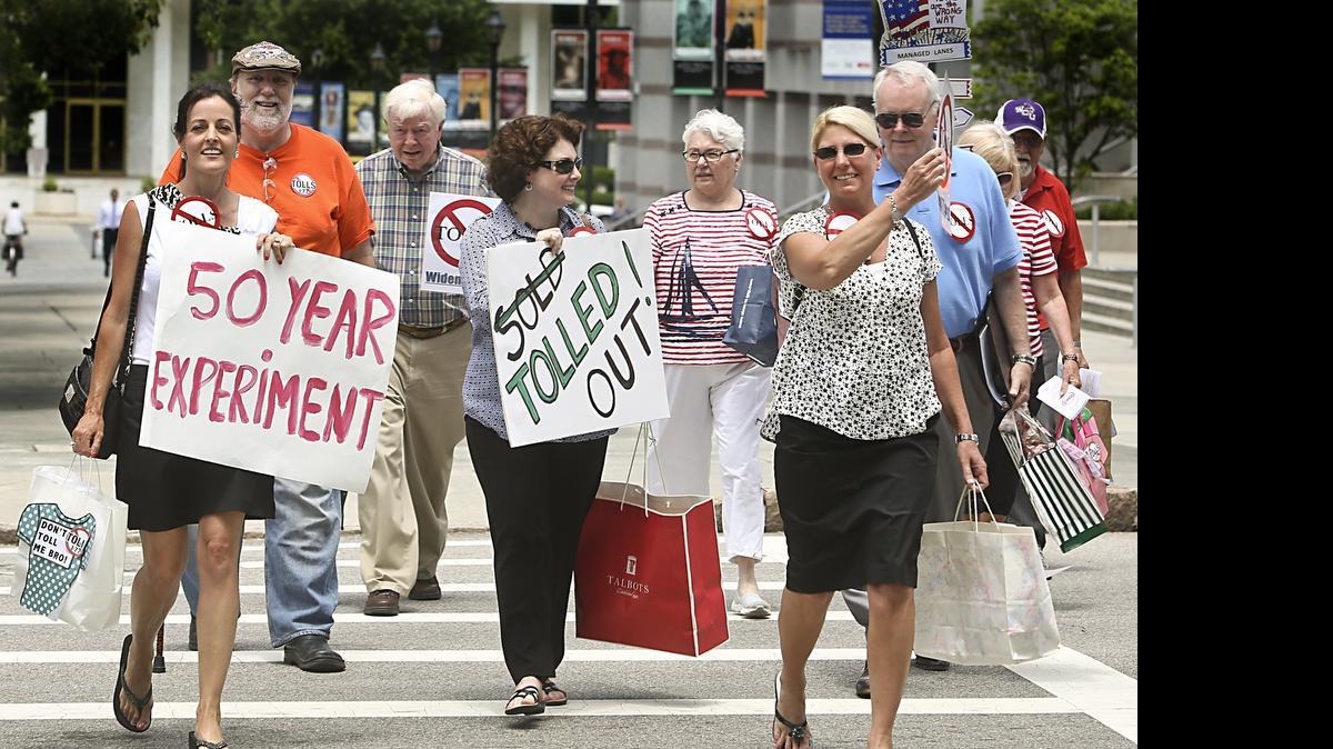 
A small group of opponents of the I-77 tolls (from left) Vallee Bubak, Sharon Hudson, and Carole Gibbons, walked from the N.C. State Capitol to the Administration Office Building on Tuesday in an effort to give Gov. Pat McCrory 5,000 petitions from state residents. They also handed out leaflets at the N.C. General Assembly, urging lawmakers to defund and cancel the $655 million project.
