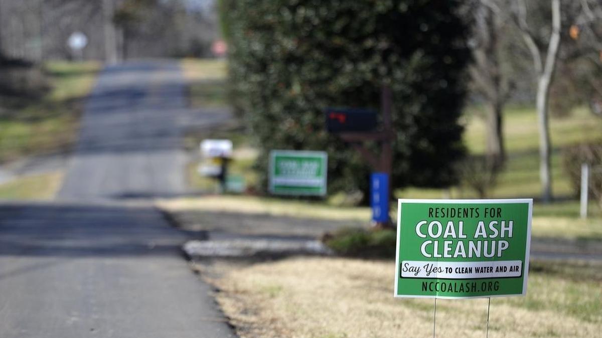 Residents near the Allen Steam Station in Belmont, where private well contamination has been detected, posted anti-coal ash signs in their yards.