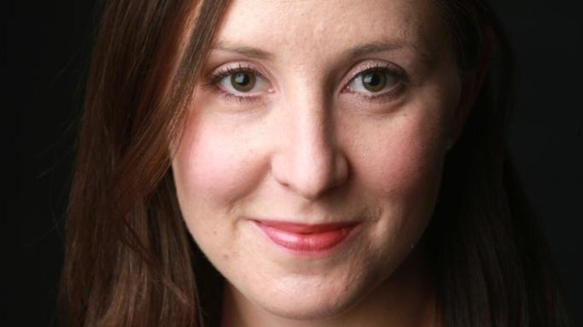 A portrait of Emily Steel of The New York Times.