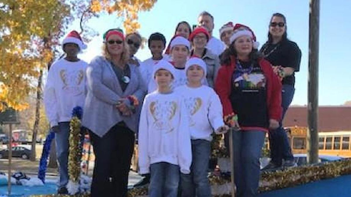 In this Charlotte Observer file photo, Donna Odrosky is shown at right wearing a red jacket and a black PFLAG shirt. She was among several members of Salisbury-Rowan PFLAG who say they were kicked off a float in the 58th annual Holiday Caravan Parade through Spencer and Salisbury in November 2017. An AVITA Pharmacy representative invited the PFLAG members to ride on its float, but parade committee members called police to keep the PFLAG members and the AVITA float from participating, Odrosky said. She is president of the PFLAG chapter. The Holiday Caravan Parade announced this week that it is shutting down, blaming hate mail and threats of protests since denying the float entry.