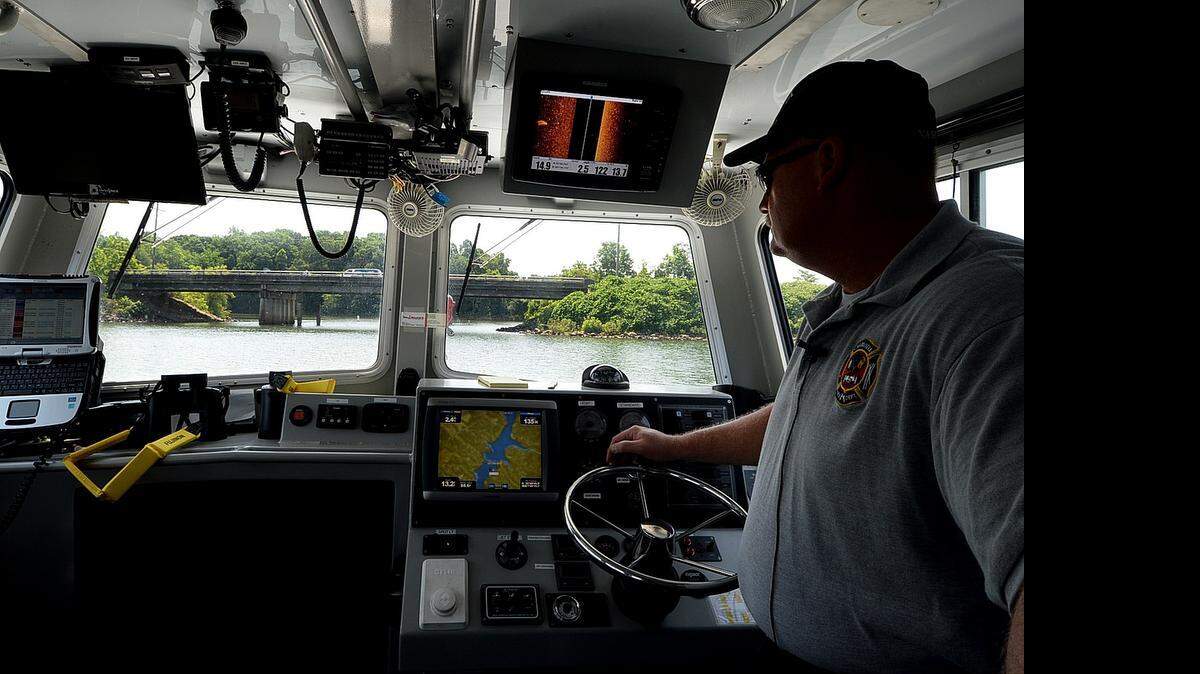 
Firefigher Engineer Rob Nastase drives a Charlotte Fire Department dive boat on Lake Wylie near CFD Station 38 during a press conference about water safety on Thursday June 25, 2015. The Humminbird sonar (screen at upper right) helped dive teams locate victims of the recent Whitewater Center and Highway 49 bridge drownings. Screen at bottom is a Garmin GPS system. In just the past two weeks, members of the Charlotte Fire Department have responded to seven emergency calls on local lakes and rivers. Sadly, those seven calls resulted in five drownings.
