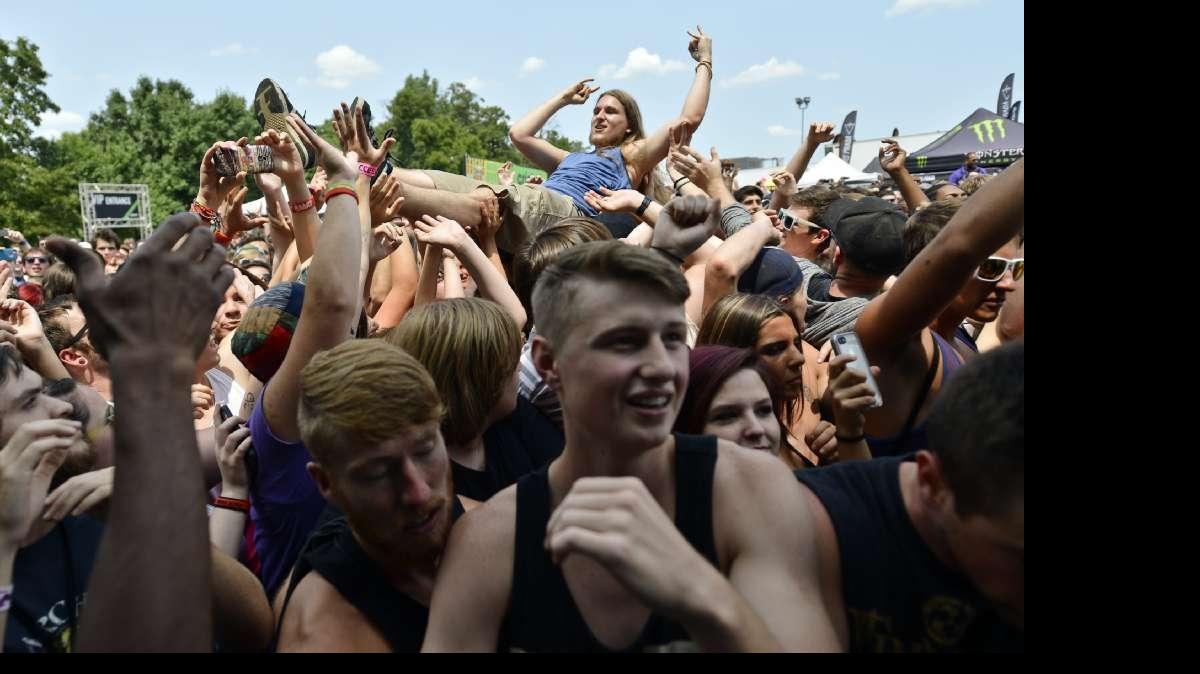 
File photo: Fans had a variety of stages to listen to bands like these fans during the Attila concert during the Vans Warped Tour in 2014 in Bonner Springs, Kan.
