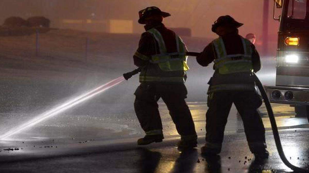 
Emergency workers on scene on East Independence Boulevard at the site of a concrete spill that has closed all westbound lanes on the highway in Matthews Wednesday morning.


