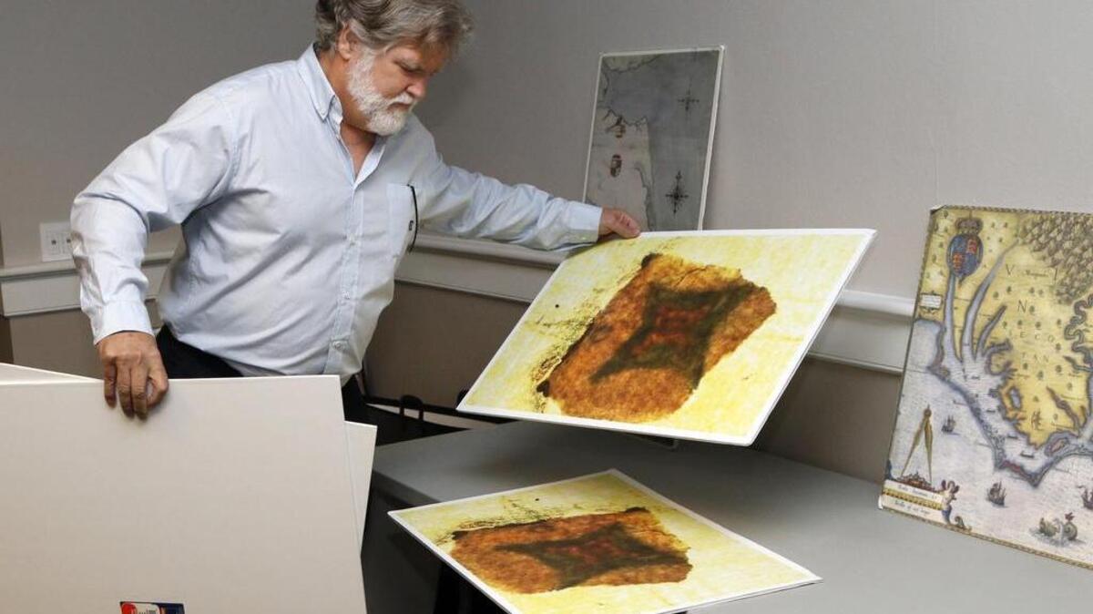
First Colony Foundation Bill member Brent Lane lays out poster boards for visitors of 16th century maps and one of the detail of the hidden fort marking under a patch on the Virginea Pars map of 1585-86 before a presentation by the First Colony FoundationTuesday, August 11, 2015 in Wilson Library on the UNC-CH campus. Members of the First Colony Foundation archaeology team have spent the last three years exploring a tract of land called Site X in eastern Bertie County off the Albemarle sound where the group contends that from evidence they have found so far that there is a strong indication that some Roanoke colonists to the east were there. 
