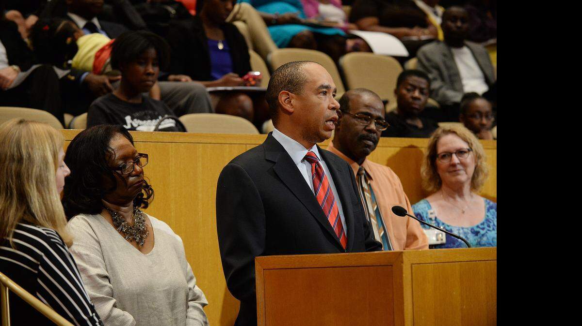 
Charlotte Community Health Clinic chairman, Doug Young, along with fellow board members, addressed the county commissioners during the public budget hearing at the Charlotte-Mecklenburg Government Center on Wednesday, June 10, 2015. County commissioners listened to Charlotte organizations and public agencies requests for continued funding as a part of the upcoming budget plan. 
