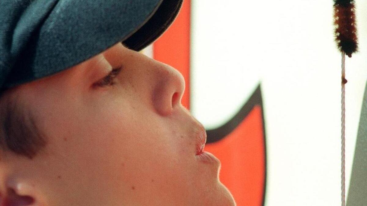Some contestants blow on their woolly worm to encourage it to climb the string faster.