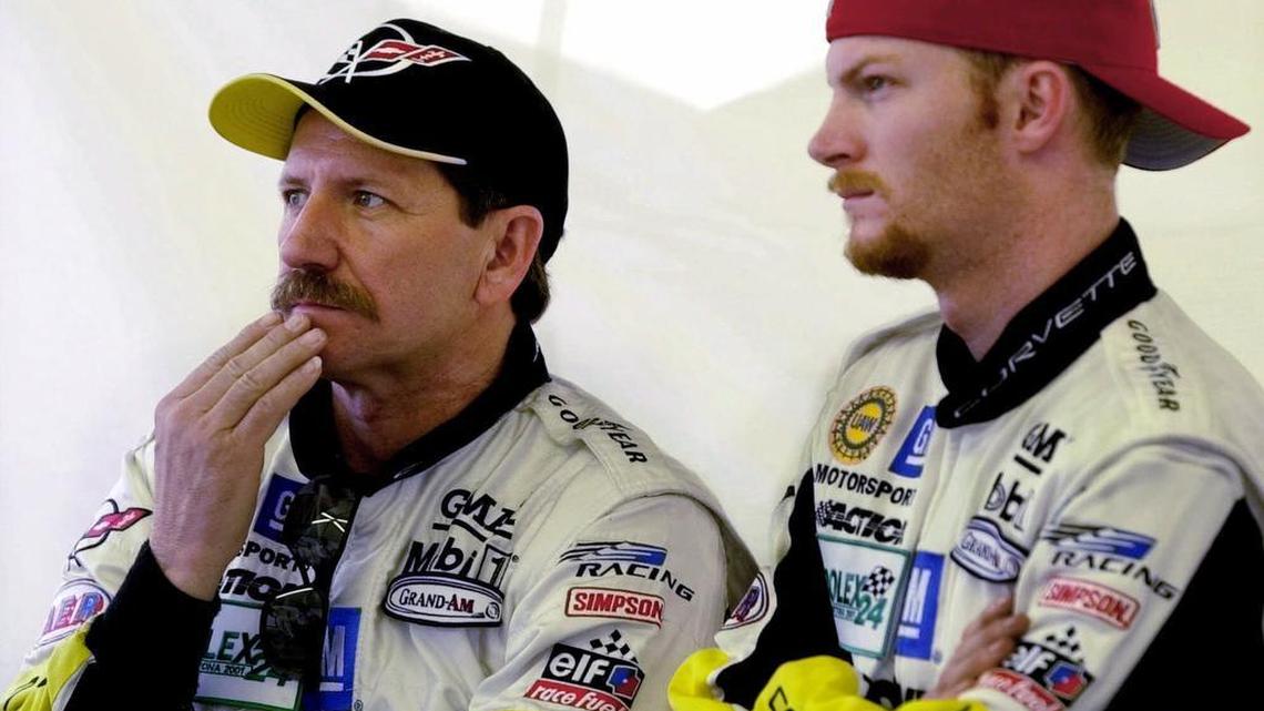 Dale Earnhardt and son Dale Earnhardt Jr. watch a race at Daytona International Speedway on Feb. 1, 2001. The elder Earnhardt died in a crash at Daytona 17 days later.