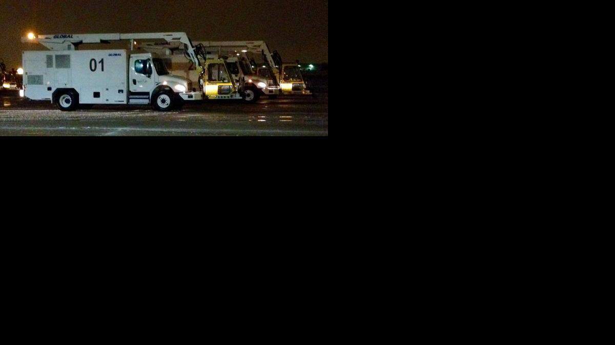 
Trucks prepare to de-ice planes at Charlotte Douglas International Airport early Thursday.

