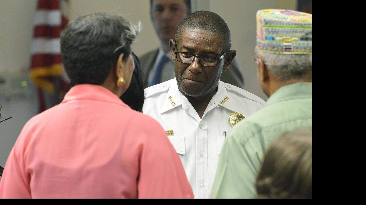 
Well wishers crowd around Rodney Monroe, who is retiring as CMPD chief, prior to the Tuesday Morning Breakfast Forum. Andrew Murray, Mecklenburg County District Attorney and Monroe spoke at the Tuesday Morning Breakfast Forum. The forum was held at the Ivory Baker Recreation Center on Tuesday June 16, 2015. 
