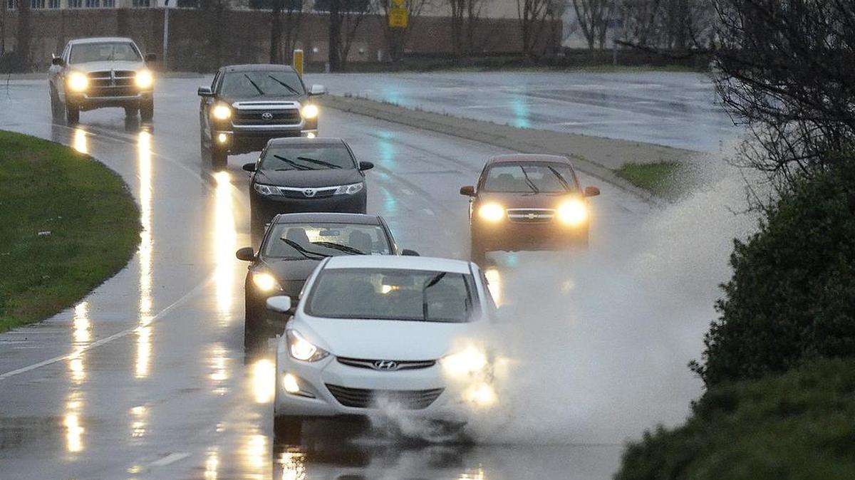 In this 2015 file photo, drivers plow through puddled water on Mallard Creek Church Road between Claude Freeman Drive and Senator Royal Place. Two inches of chilly rain could fall across the Charlotte area on Wednesday, in a rude reversal of Tuesday’s sunny skies and unseasonably balmy temperatures.