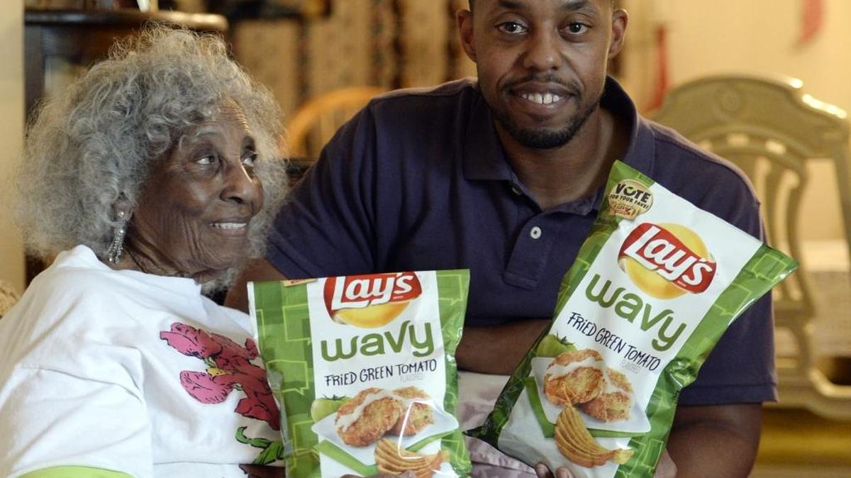 Greg Pope of Charlotte shares some of the Lay’s Wavy Fried Green Tomato potato chips he inspired with his grandmother, Lillian Pope.