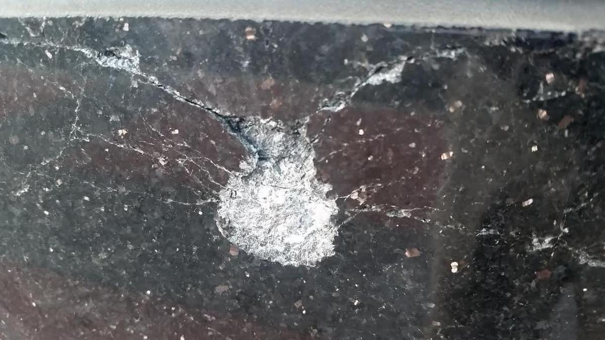 Bullets created marks in the entrance to the Skye Condominiums.