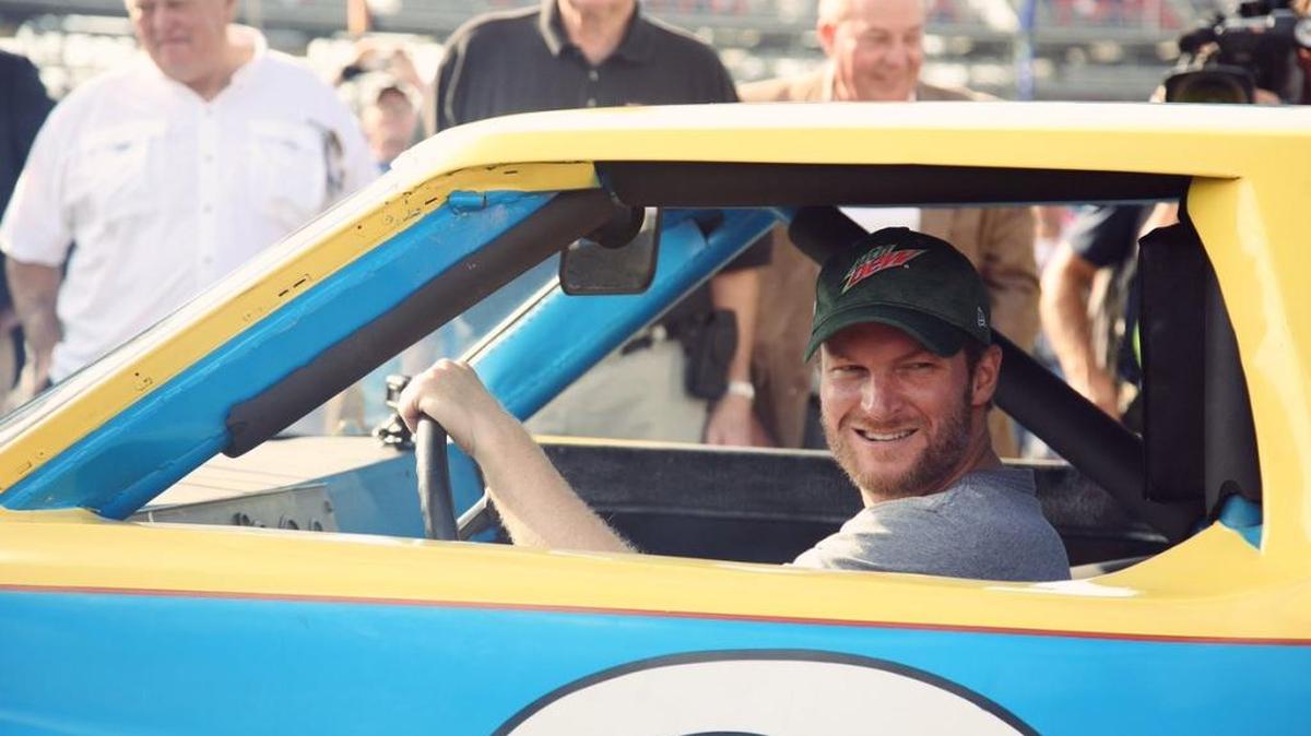 Dale Earnhardt Jr. prepares to take a spin around Talladega Superspeedway on Friday in the Chevy Monte Carlo that his dad drove on his way to his first championship. The speedway gave the car to Earnhardt as a farewell gift as Earnhardt retires at the end of the season. The gift was given on behalf of the International Motorports Hall of Fame and the state of Alabama.