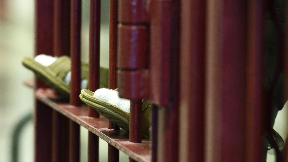 As authorities investigate a recent flurry of inmate suicides, the North Carolina prison system has rolled out a plan to prevent more inmates from taking their own lives. Here, an inmate waits in a temporary set of cells after an infraction at Lanesboro Correctional Institution.