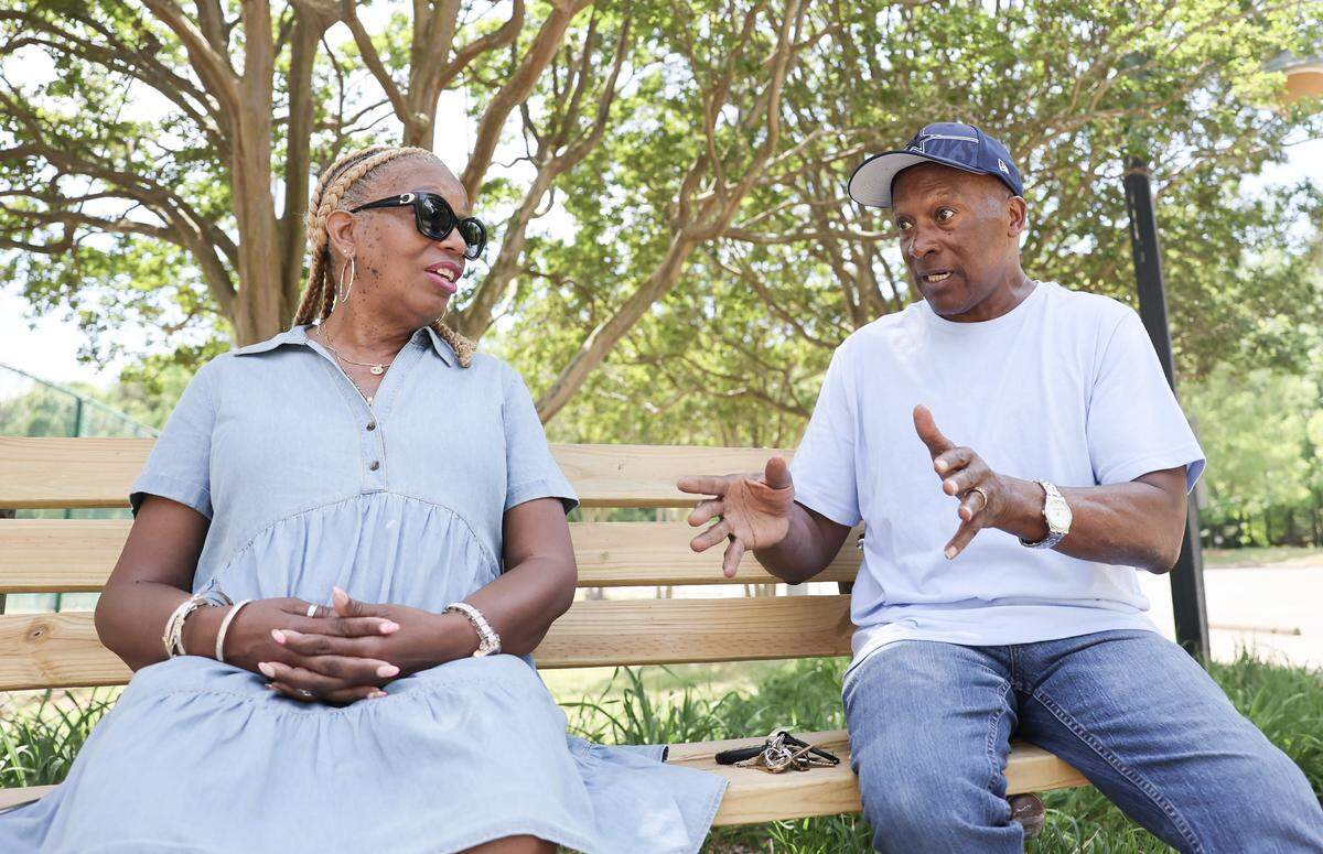 Sheila Andrews, left, and David Harris talk about their time working at CATS.