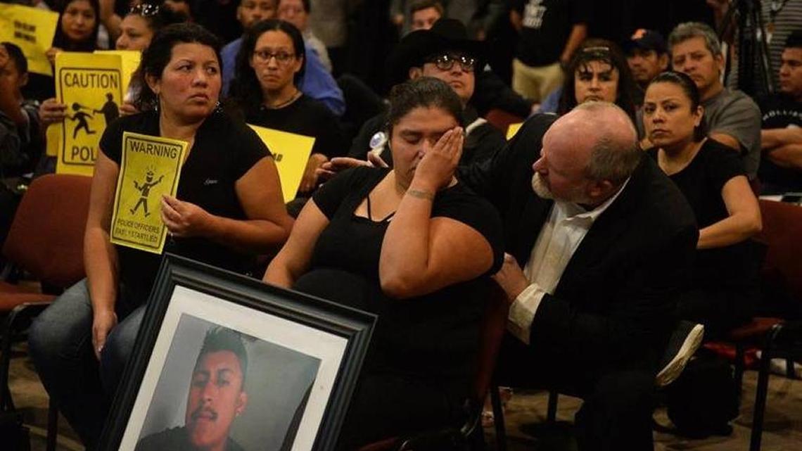 Ruben Galindo’s widow, Azucena Zamorano, cries and is comforted by Pastor Rusty Price at a discussion between Charlotte-Mecklenburg Police and the Latino community in October.