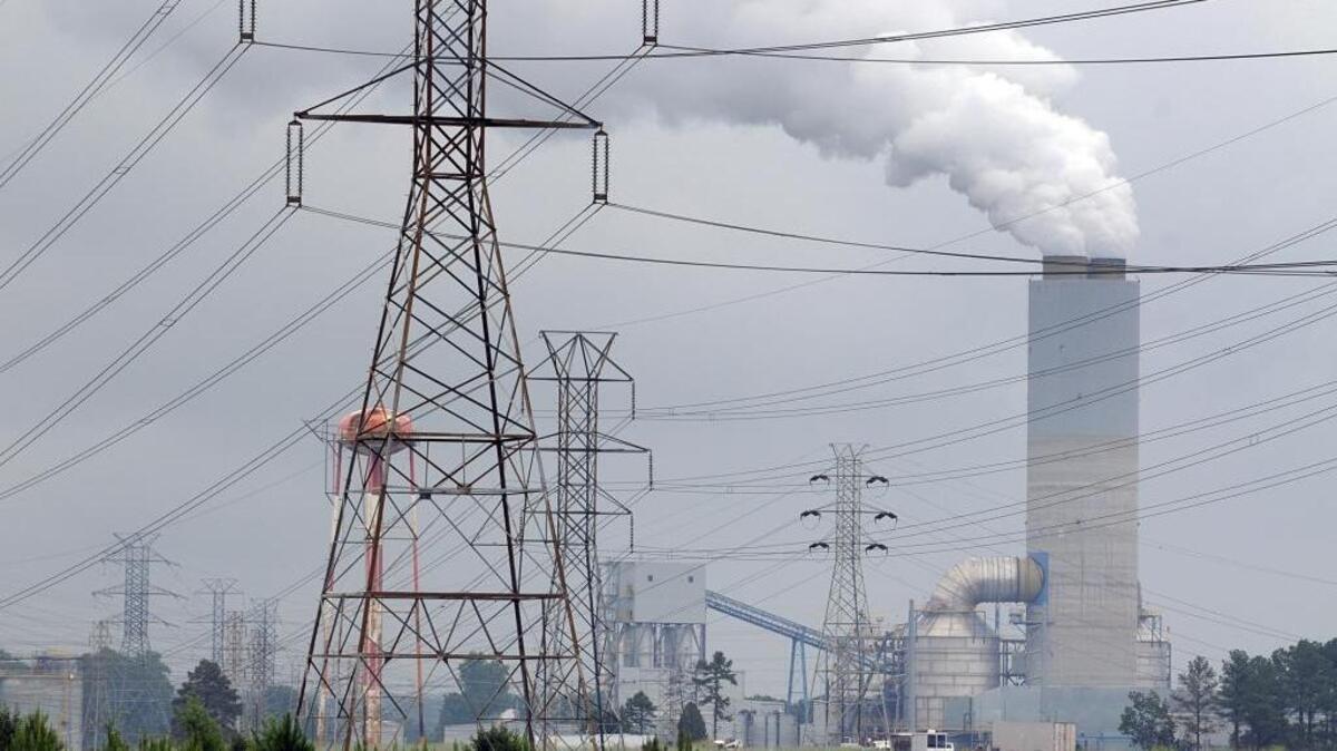 In this 2009 photo, a cloud of steam rises from a 365-foot stack at Allen Steam Station near Belmont.