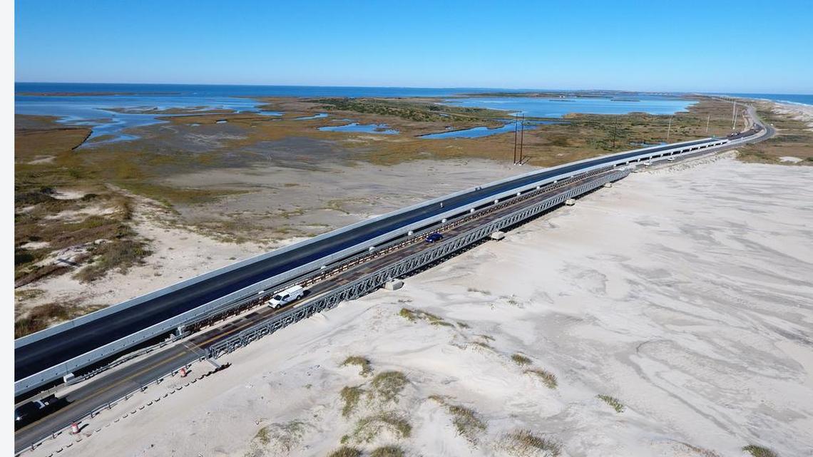 In this file photo from November 2017, the new concrete Pea Island Interim Bridge parallels the temporary metal truss bridge that was built to carry N.C. 12 over a new inlet on Hatteras Island created by Hurricane Irene in 2011. The bridge was named on Tuesday in honor of Captain Richard Etheridge, a former slave who became the leader of the Pea Island Life-Saving Station. The all-African American Coast Guard unit is credited with saving countless lives, according to the N.C. Department of Transportation.