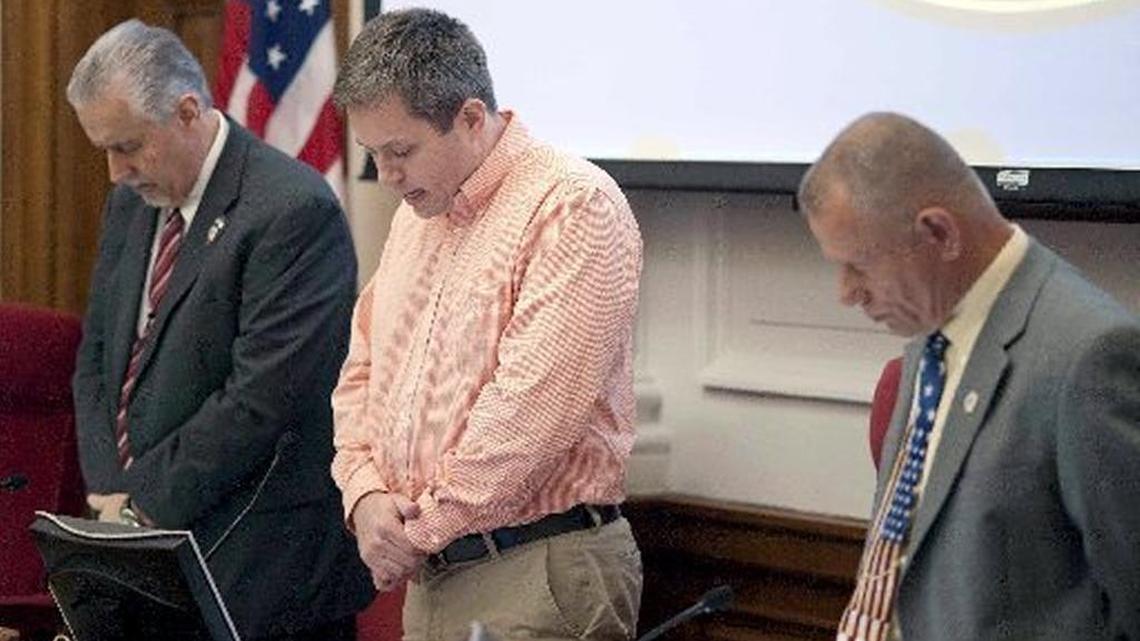 Rowan County commissioners pray in this 2013 photo.