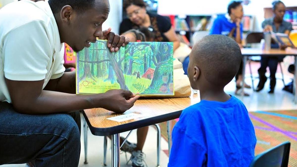 A young family participates in the Family Independence Initiative, a program instituted by GreenLight in Boston, which empowers families to move out of poverty through connections, choice and capital.