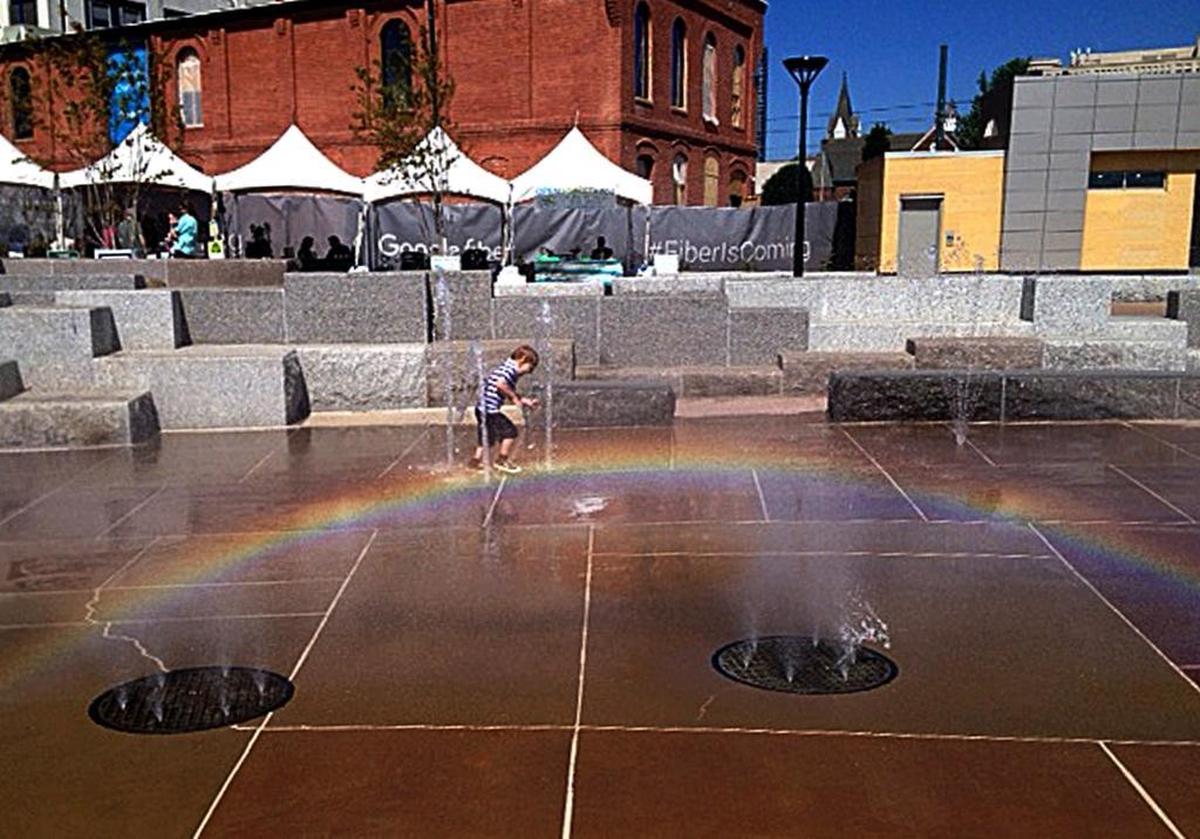 Cooper Broach, 3, spent Saturday morning at Earth Day festivities at First Ward Park splashing through the park’s water feature.