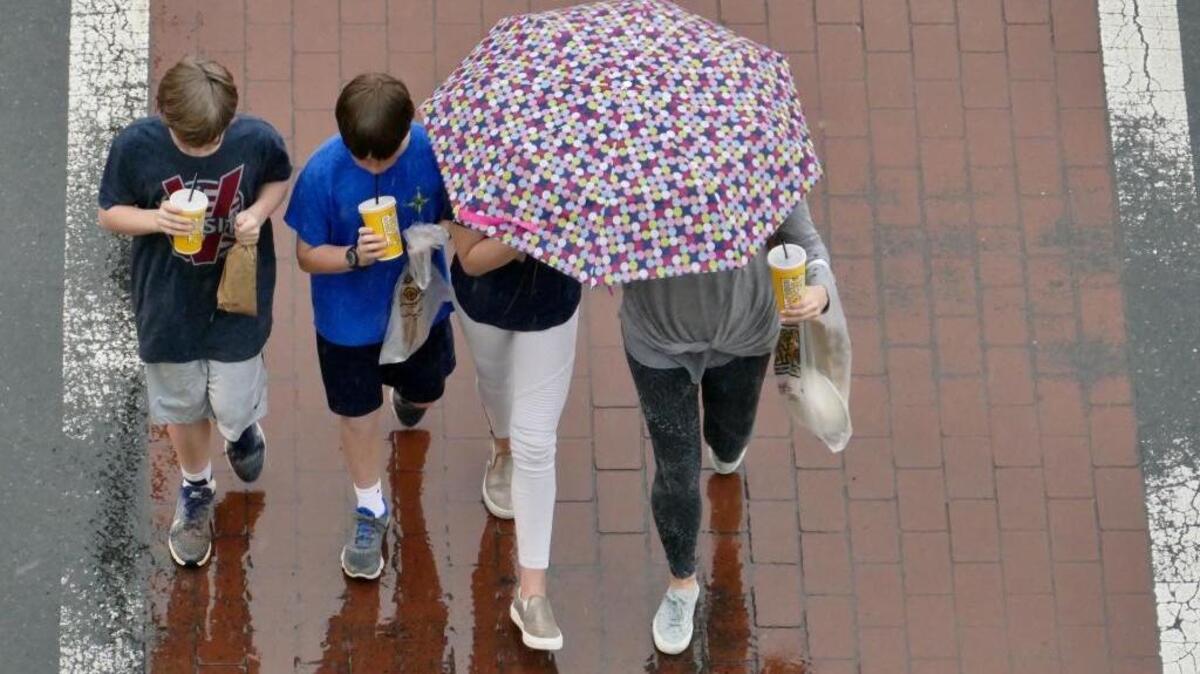 Folks crossing Charlottetowne Ave. at Metrolina Ave. Wednesday afternoon.