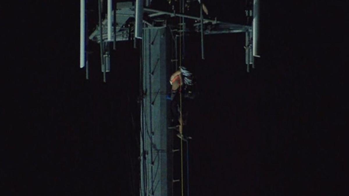 Firefighters responded to a high-angle rescue involving two workers who were stuck on top of a cell tower in south Charlotte on Thursday night.