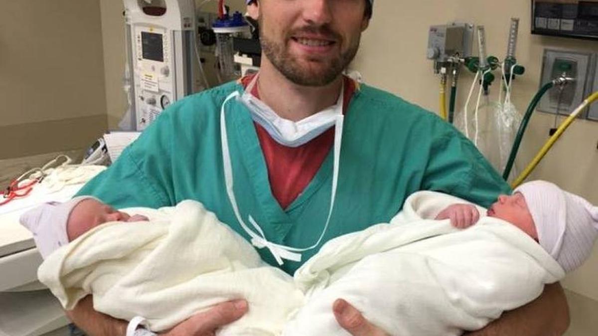 Gentry Eddings holds his newborn twins, Isaiah Dobbs and Amos Reed.