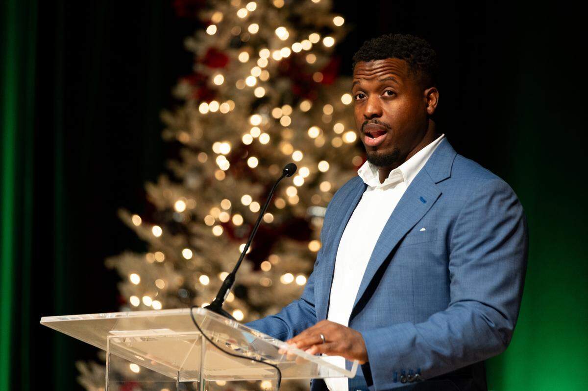 Former Carolina Panther Jonathan Stewart speaks during the Good Fellows Luncheon.