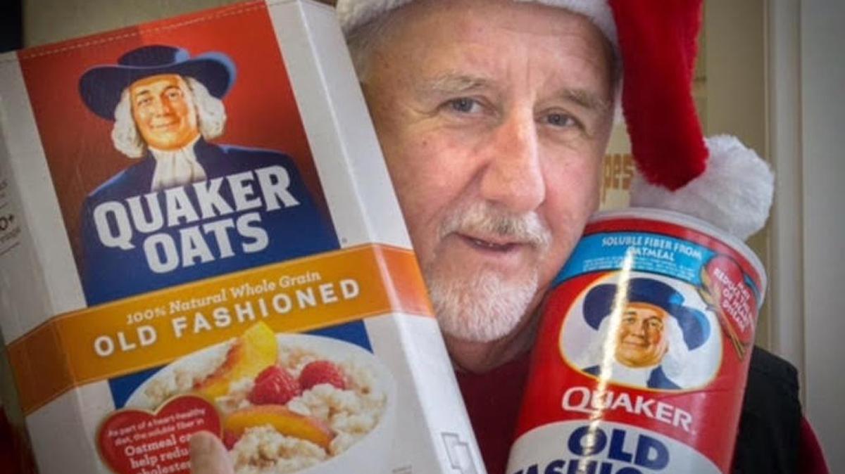 Myers Park Baptist Church deacon Bob Bishop shows off items donated to homeless shelters during a previous year’s oatmeal drive.